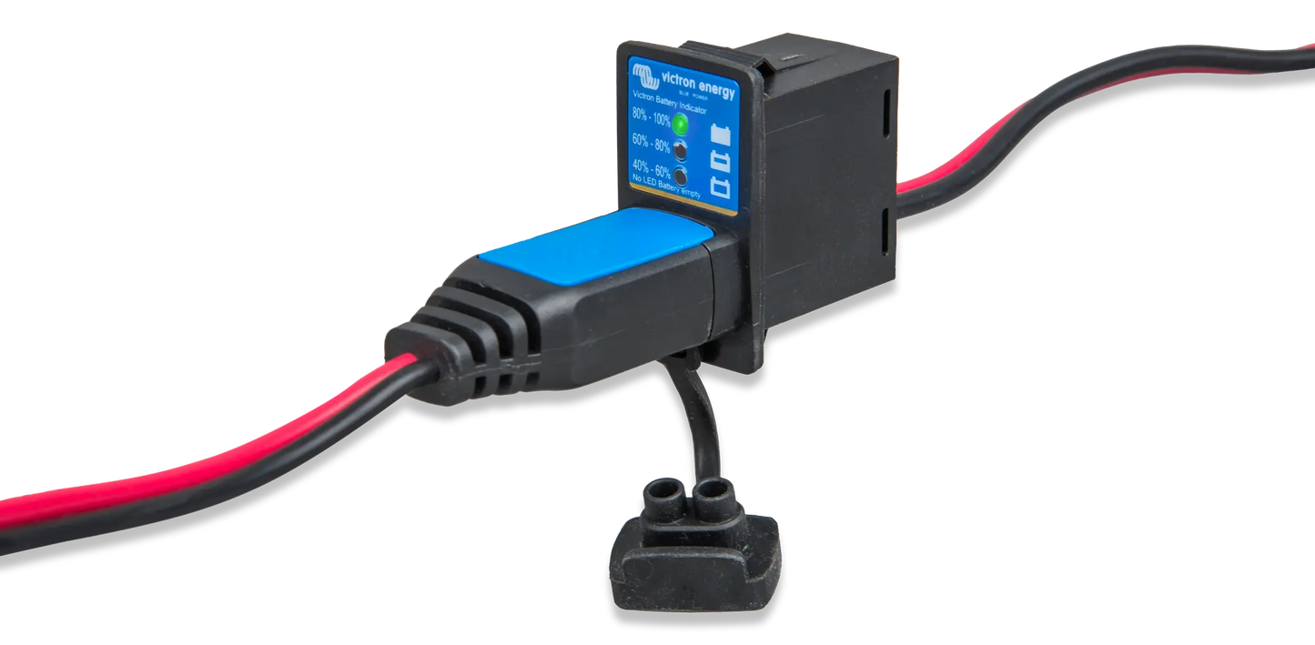 Electronic device with blue display and red and black wires on a white background