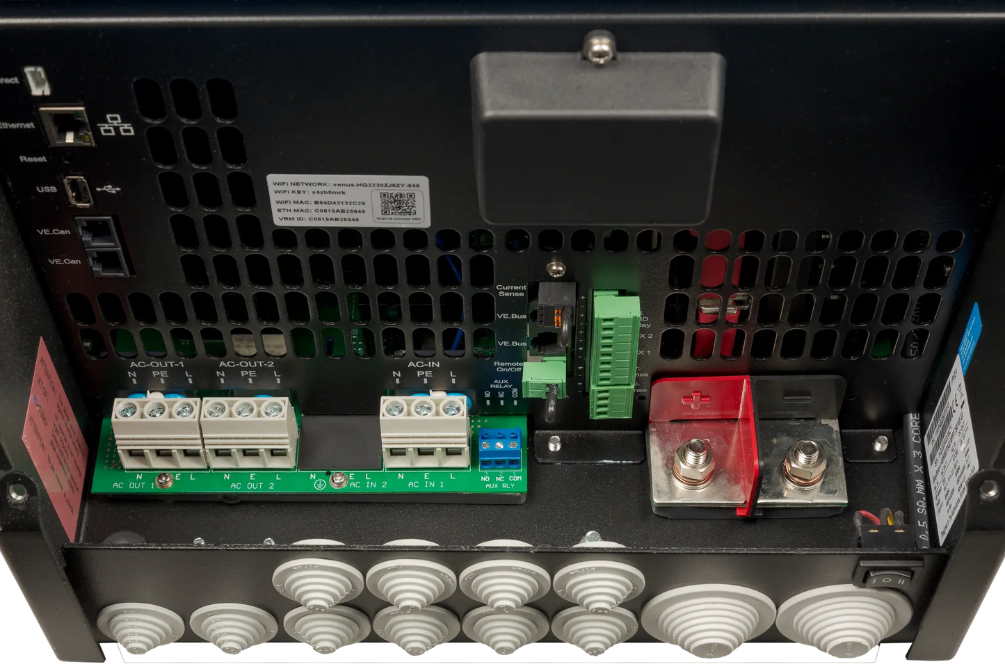 Back view of electronic equipment with various connectors and components.