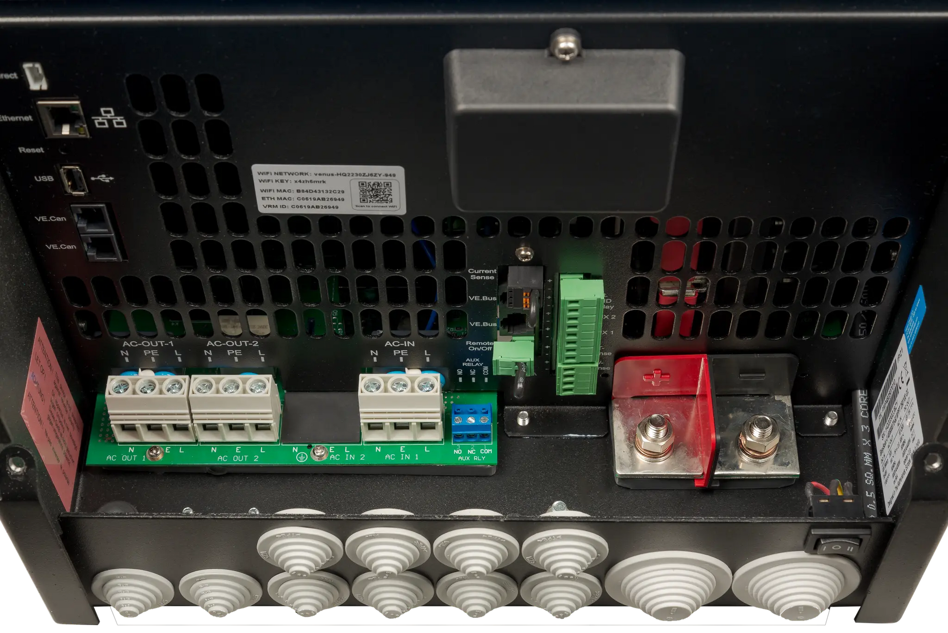 Back view of electronic equipment with various connectors and components.