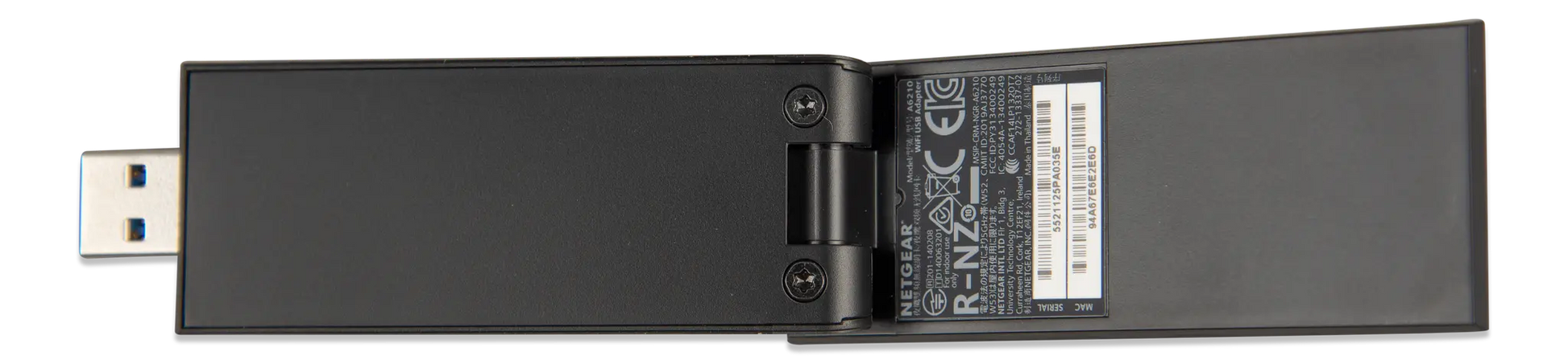 Black USB adapter with label on a white background