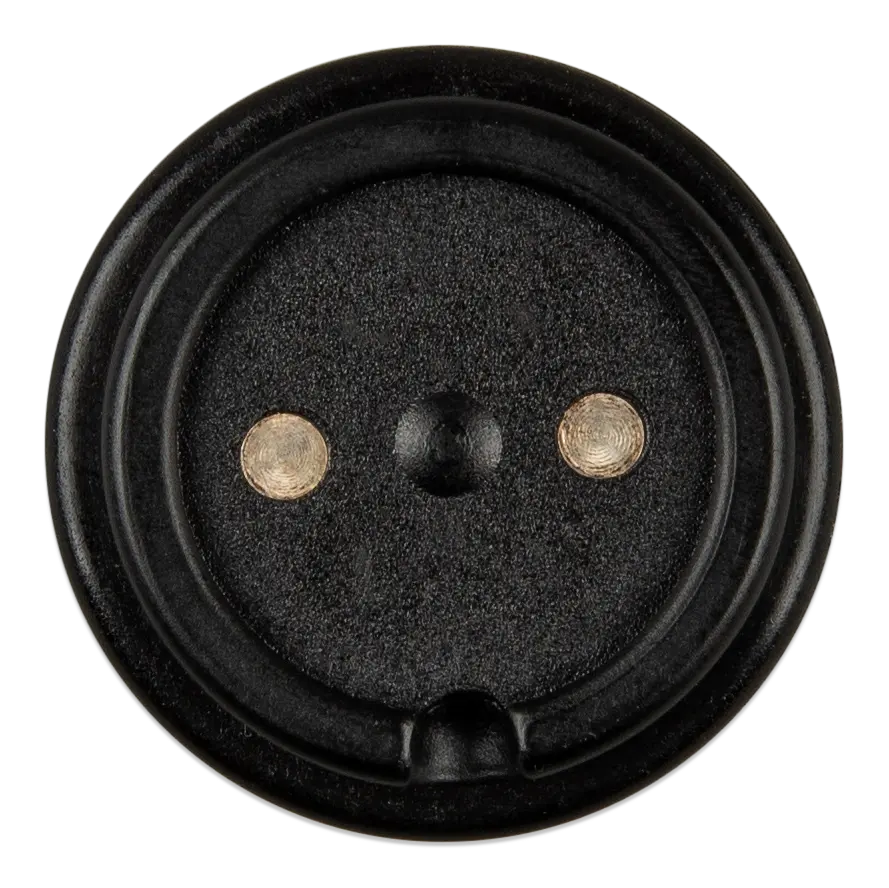 Black speaker driver with two metal washers on a white background