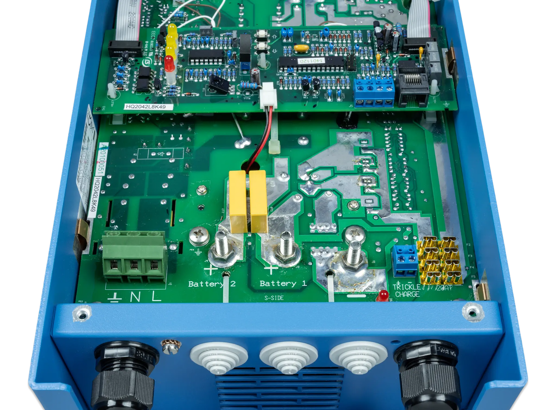 Close-up of a blue electronic device with a green circuit board on a white background