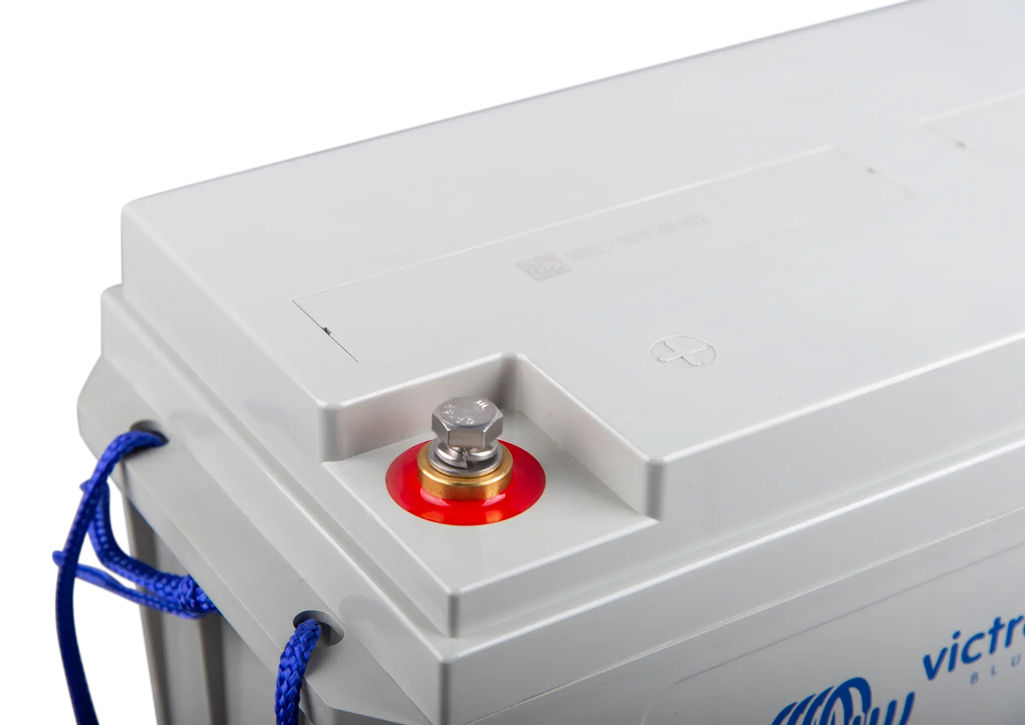 Close-up of a battery with a red terminal and blue cable, branded 'Victor'.